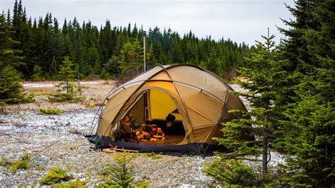 Winter camping on a frozen lake in a hot tent in -10c14f temperatures Inside the tent 30c86f